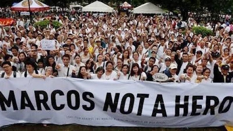 15,000 brave rain to protest Marcos burial