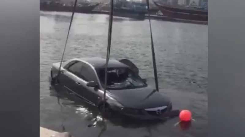 Parked car falls into Dubai Creek