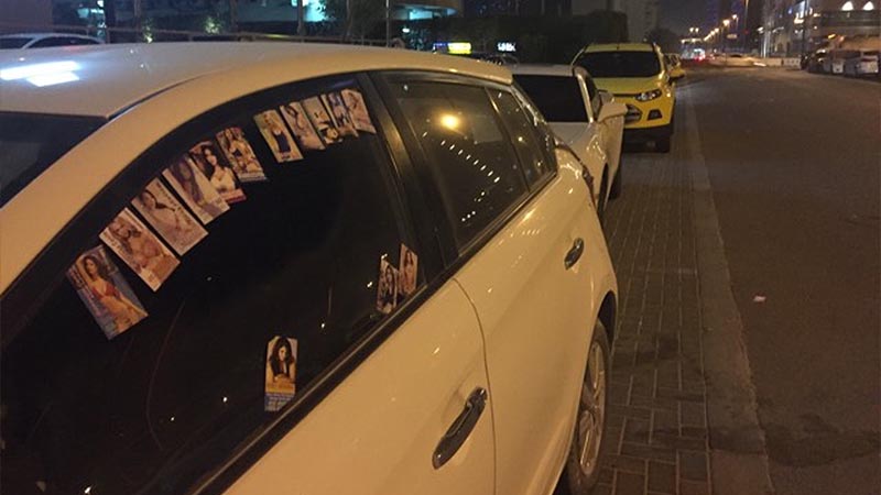 Dubai policeman 'attacked' by men leaving massage cards on cars