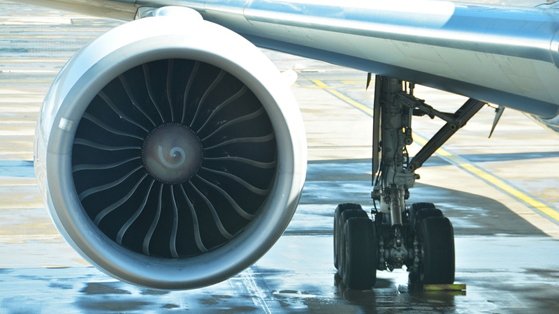 Woman arrested for tossing coins at plane engine