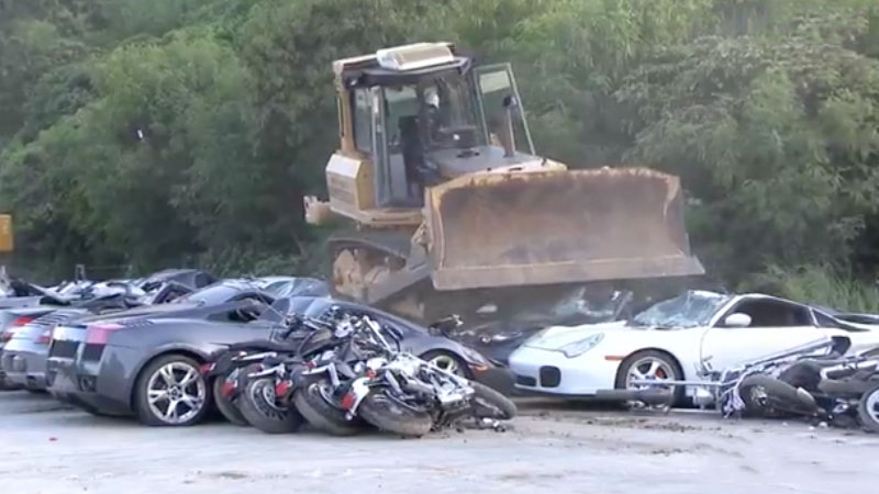 VIDEO: Smuggled Lamborghinis, Porsches bulldozed as Duterte watches