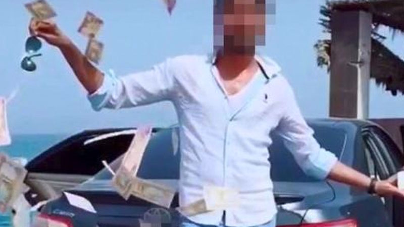 Man arrested in Dubai for throwing cash in stunt