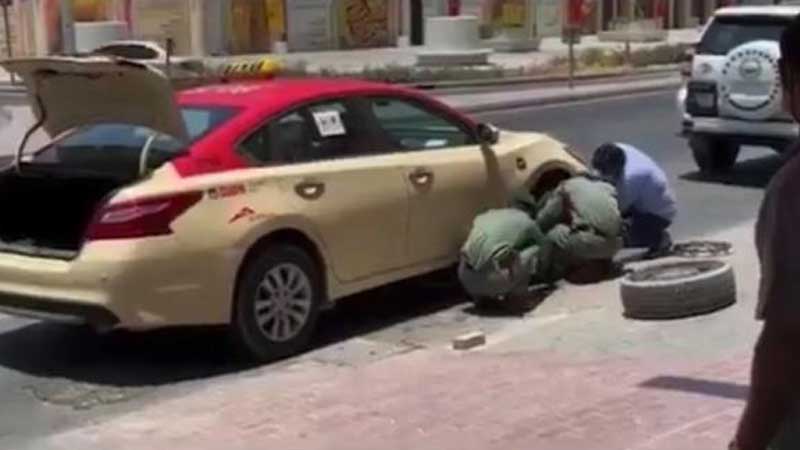 Dubai Police officers help stranded taxi driver