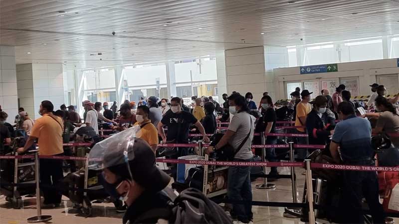 Filipinos prepare to board a chartered Philippine Airlines flight from Dubai on June 14, 2021.
