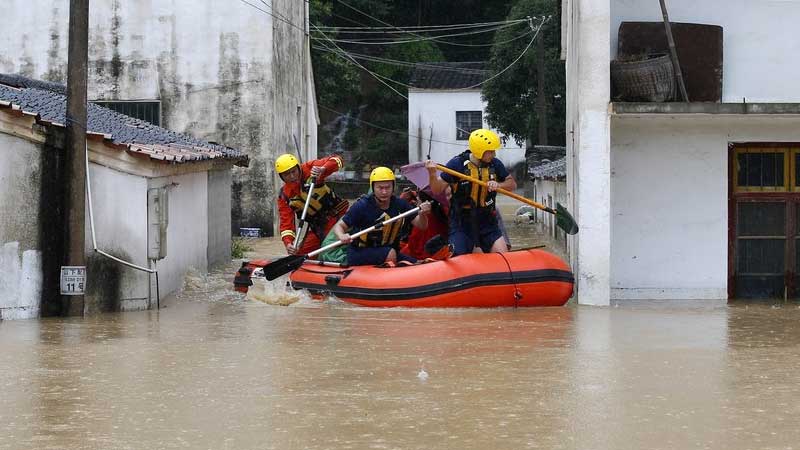 China evacuates tens of thousands as storms spread