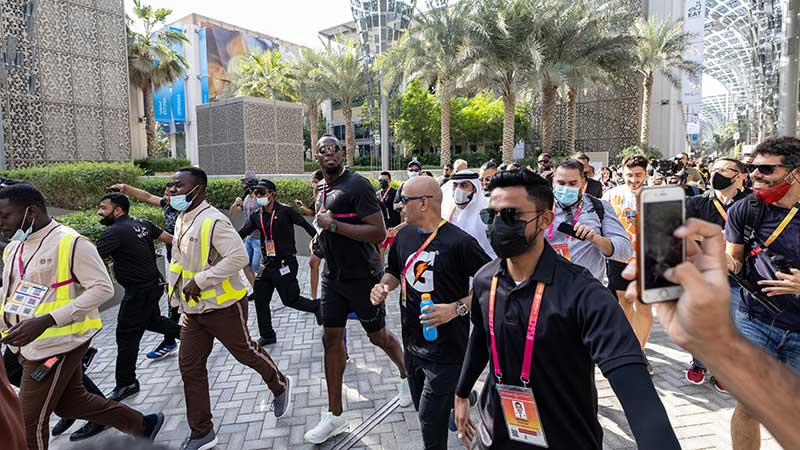 Usain Bolt runs with visitors at Expo 2020 Dubai