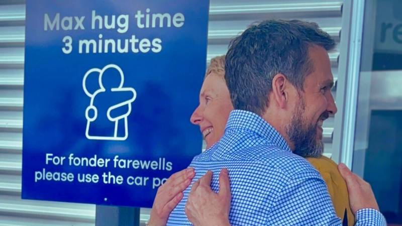 New Zealand airport sets three-minute limit on hugs