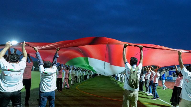 UAE healthcare workers set Guinness record with giant flag display in Abu Dhabi